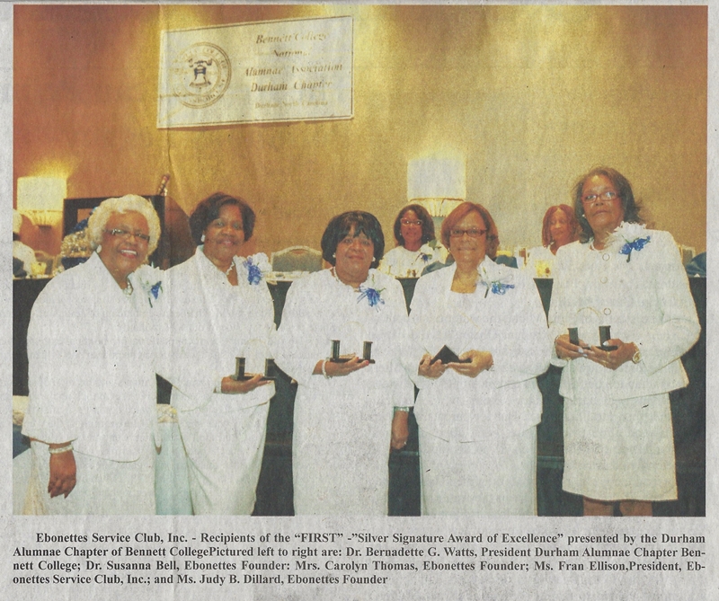Group photo of the Ebonettes Service Club, Inc. receiving an award.